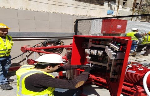 Beyond technician wiring a fire pump control panel
