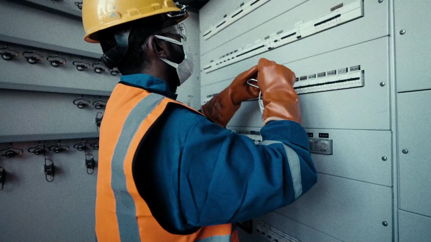 Beyond technician working on an electrical panel