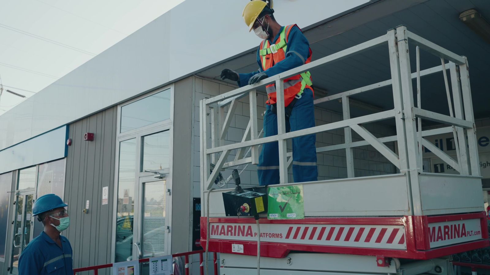 Technician working at height with harness